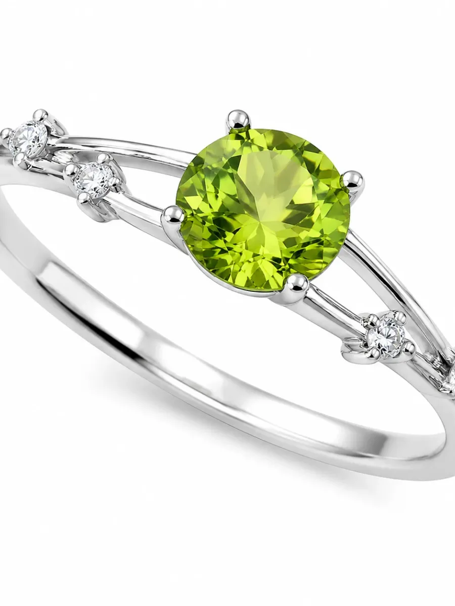 Silver-colored round emerald and diamond ring