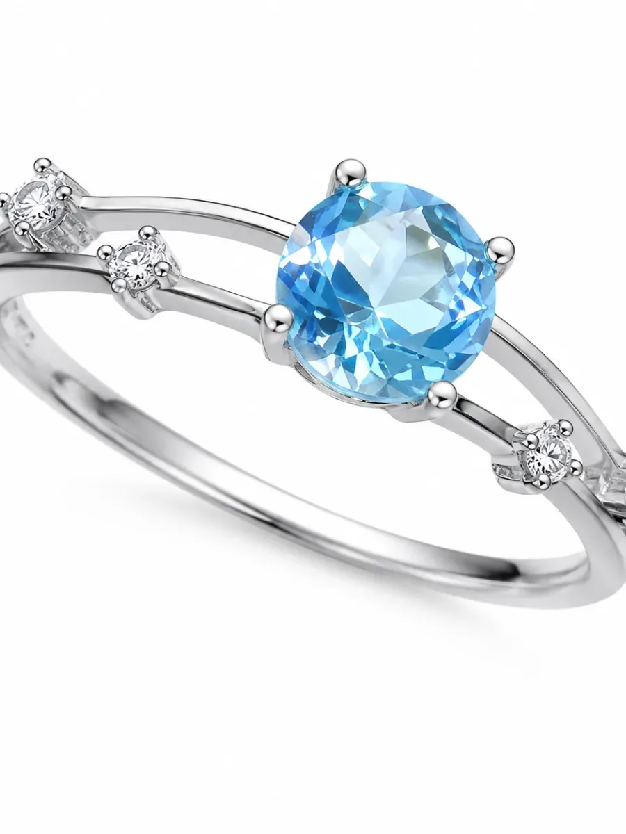 Silver-colored round sapphire and diamond ring